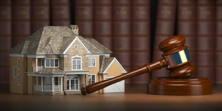 House with gavel and law books. Real estate law and house aucti