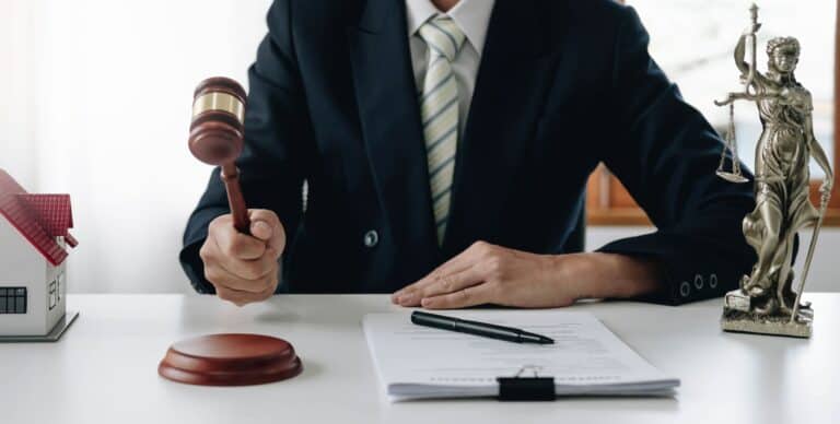 Lawyer or judge holding Hammer prepares to judge the case with justice, and litigation, scales of
